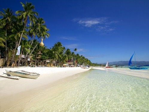 Boracay, Philippines The laid-back atmosphere of Boracay Island combined with the two-mile stretch of sparkling sand of White Beach, makes this places no less beautiful th...