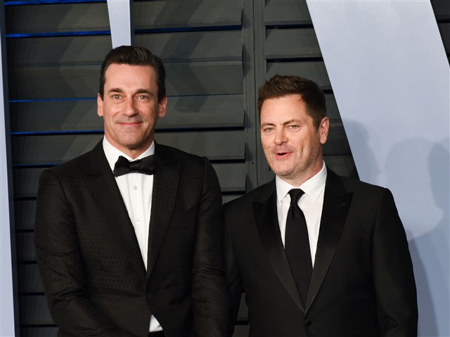 Nick Offerman and Jon Hamm When Megan Mullally was doing her solo shots, her husband Nick Offerman and Jon Hamm held hands behind her.